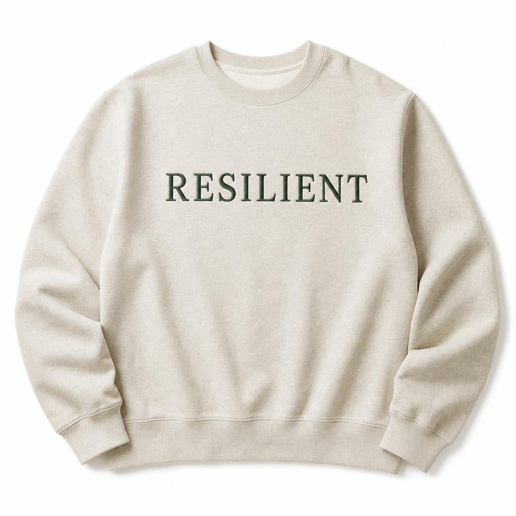 Oatmeal crewneck sweatshirt embroidered with the word Resilient