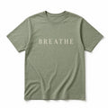 Sage green tee printed with the word Breathe