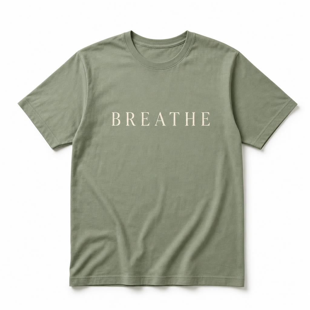 Sage green tee printed with the word Breathe