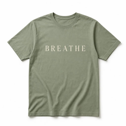 Sage green tee printed with the word Breathe